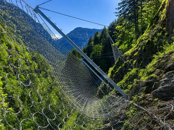 Rockfall Barrier — Dynamic rockfall barrier for protecting haul roads, infrastructure and work areas.